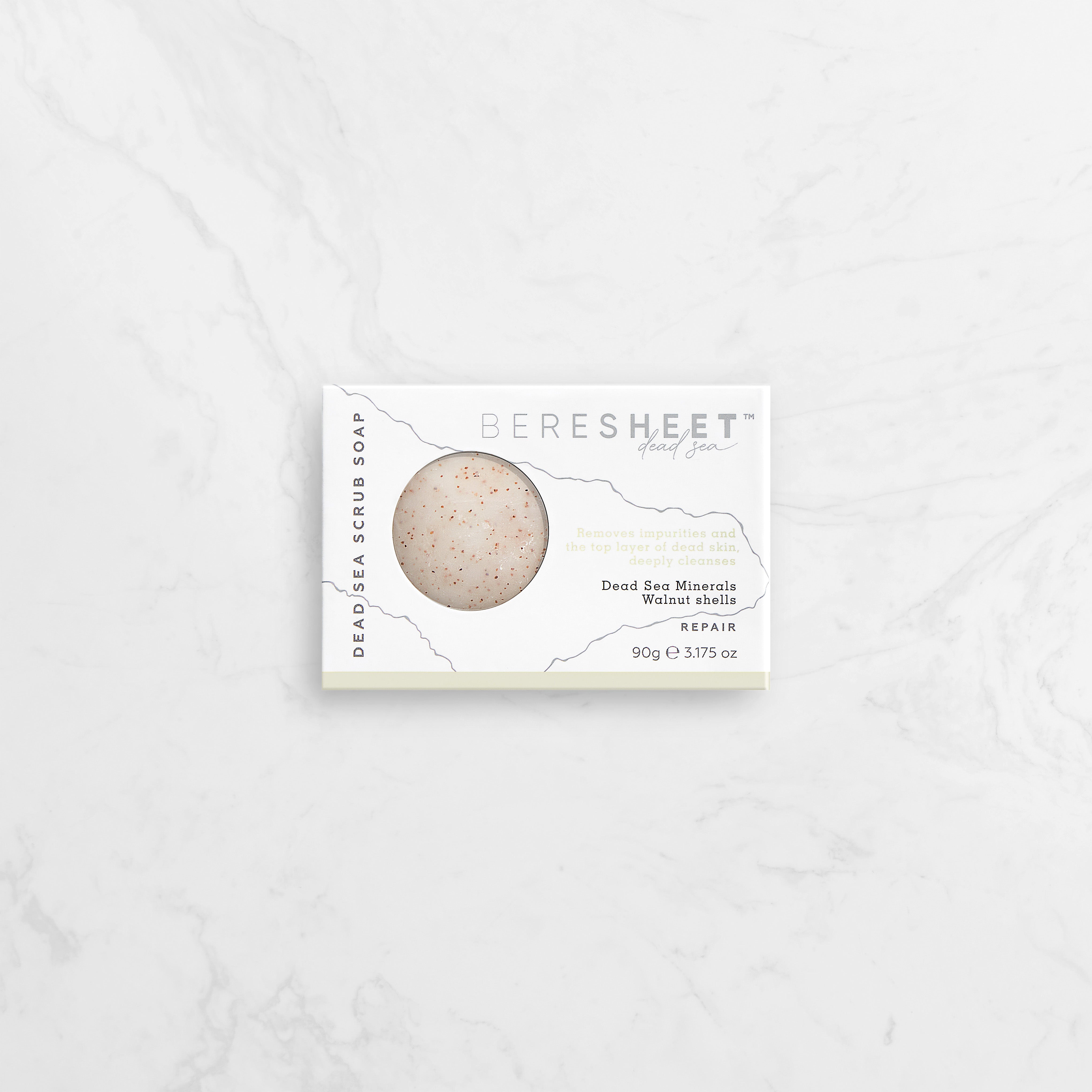 Dead Sea scrub soap in packaging on a white background