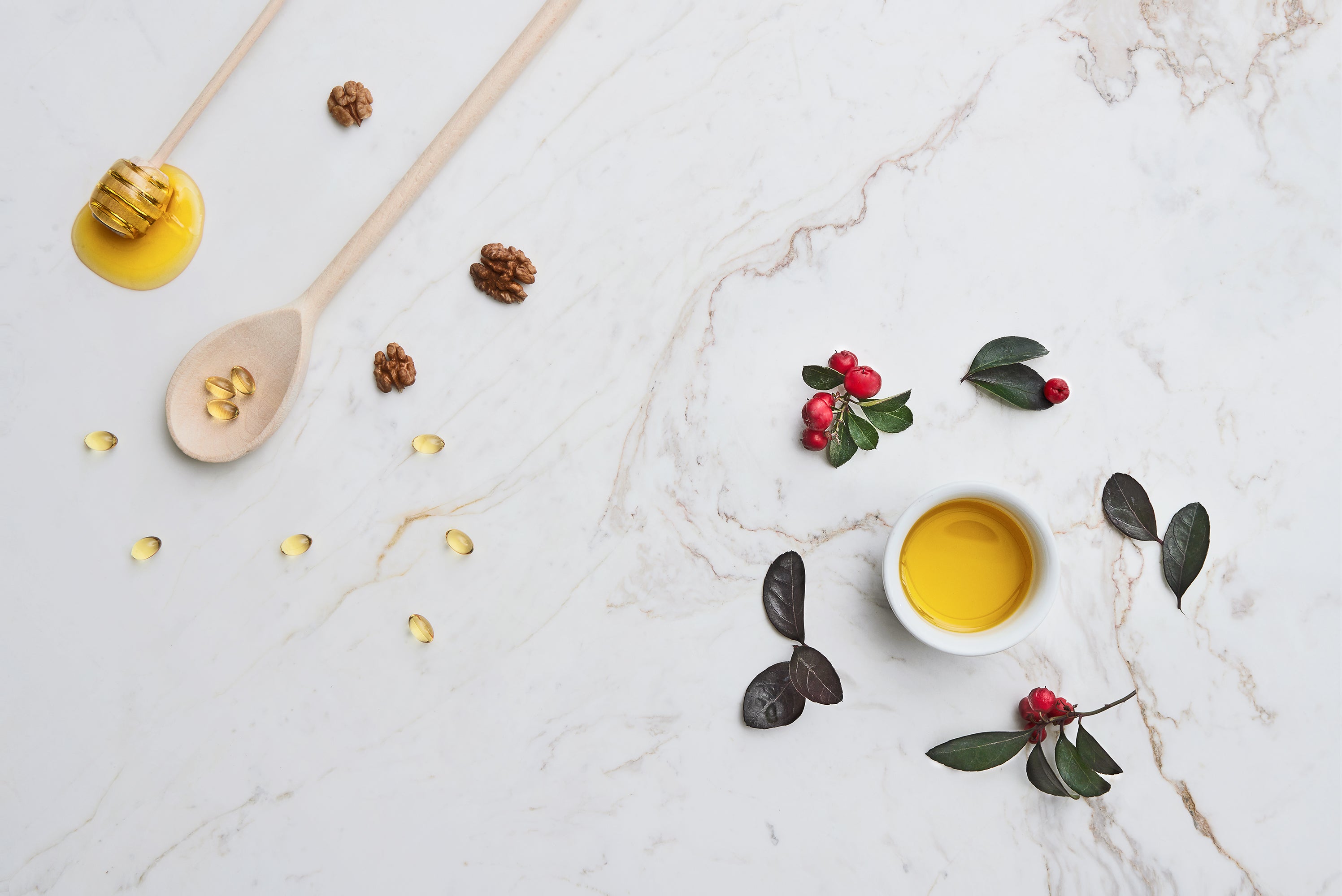 Yellow bowl with honeycomb pieces on a marble surface