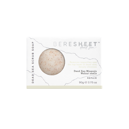 Dead Sea scrub soap with packaging on a white background