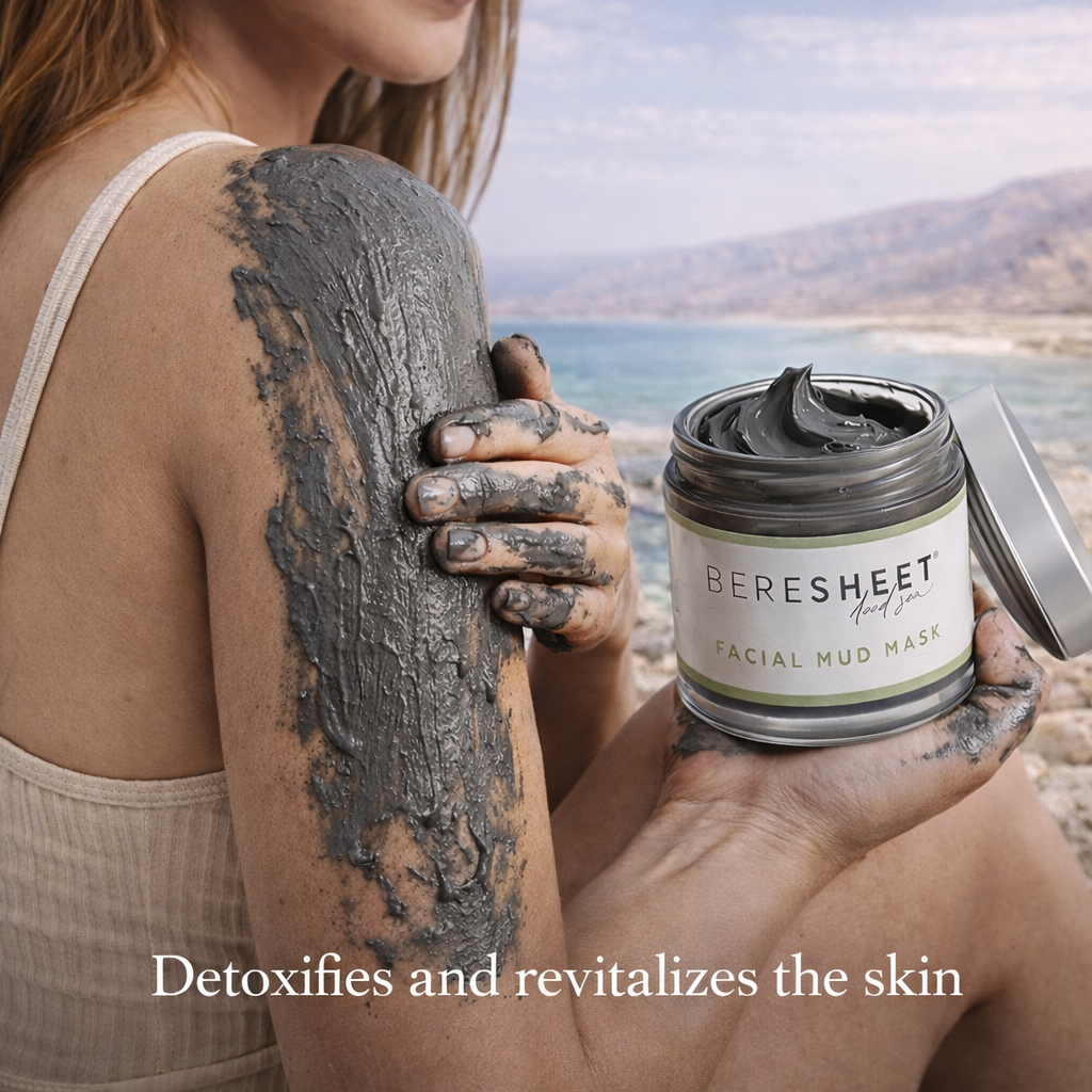 Person applying facial mud mask with Bereshet Facial Mud Mask jar against a scenic background