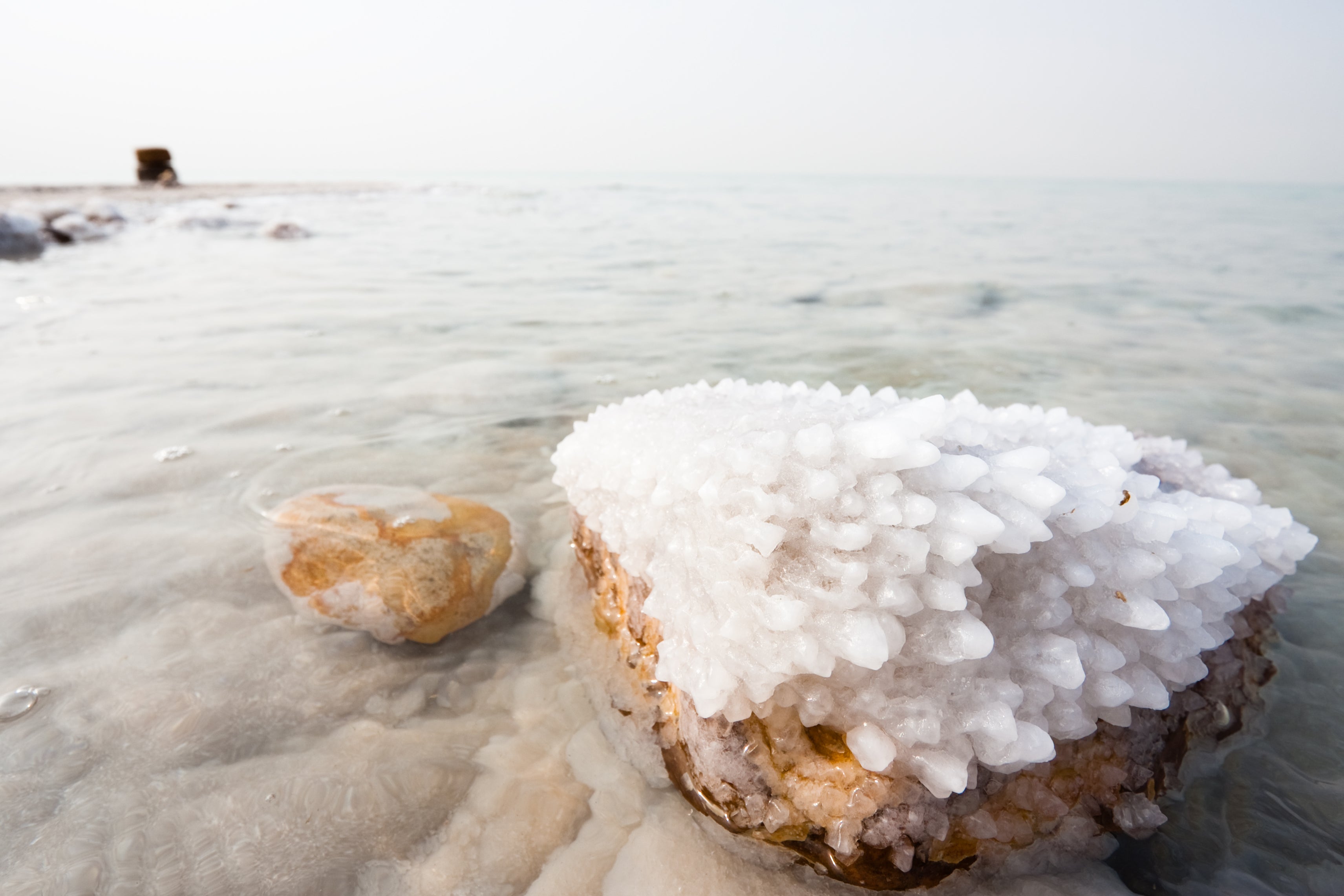 Rock with salt crystals on a beach