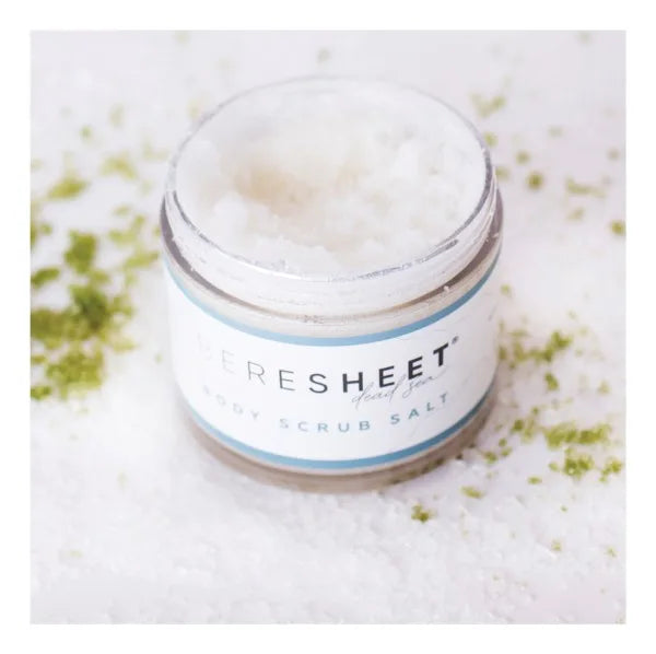 Jar of scrub salt with 'Fresheet' label on a textured surface